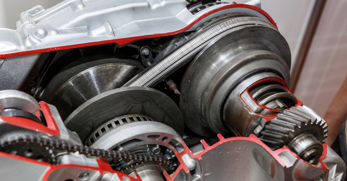 Close-up of the inside of a continuously variable transmission, featuring various gears and a chain.