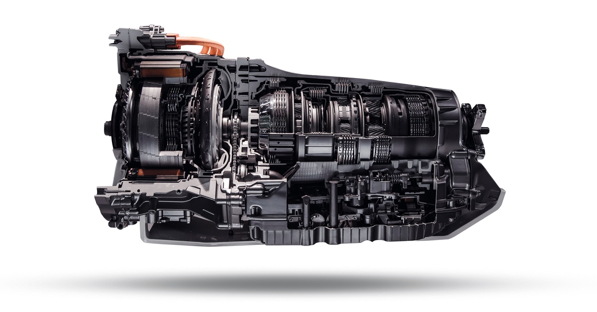 Side view of an automatic transmission against a white background. Many of the system's components are visible.