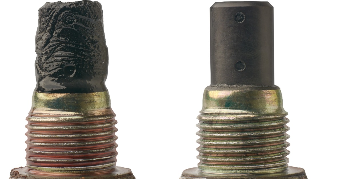 Two metal drain plugs sit on a white background. One drain plug has black sludge coating the surface, and the other is clean.